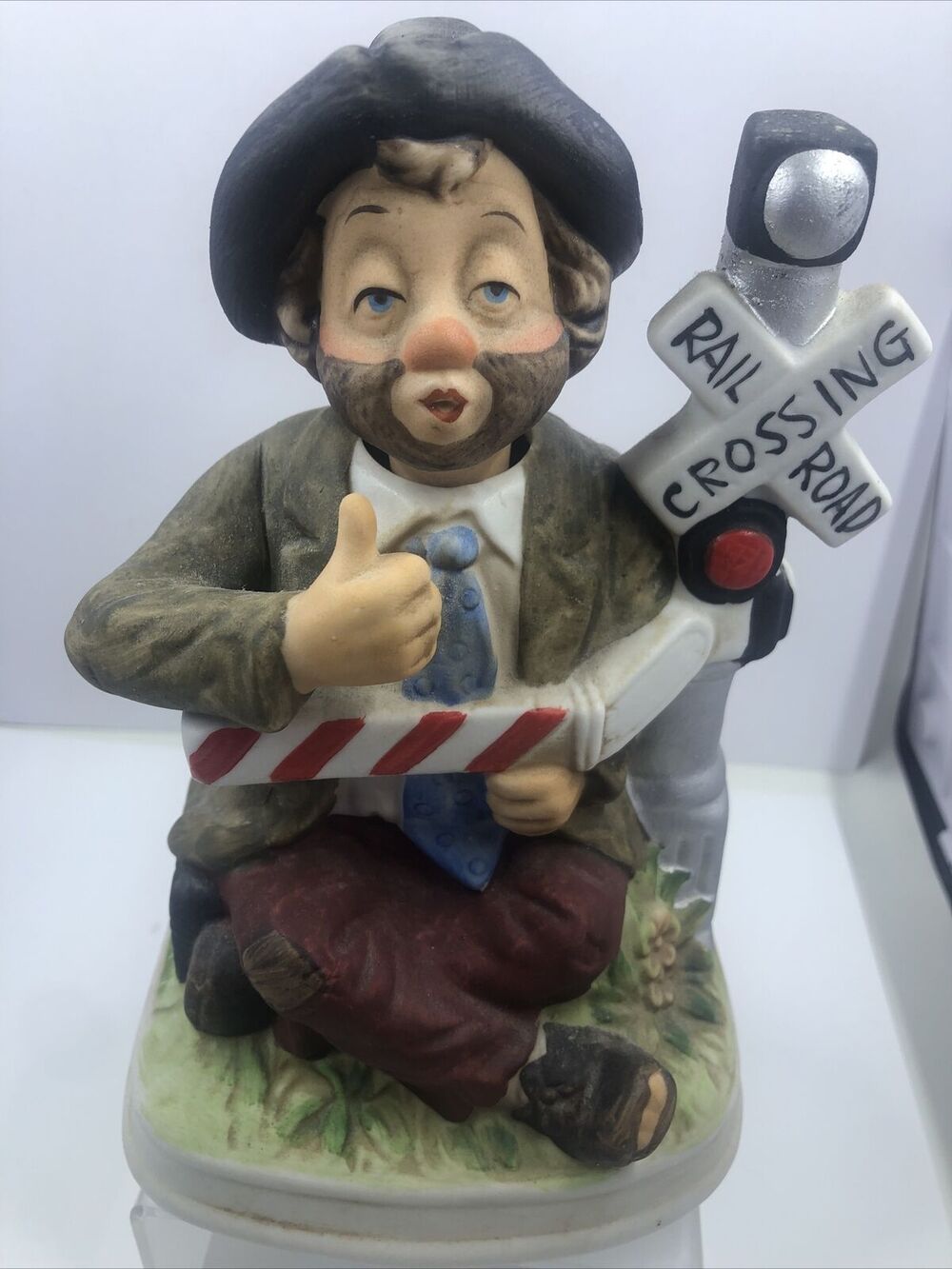 MELODY IN MOTION Railroad Cross Willie Figure Hobo Clown Music Box Doesn’t Work